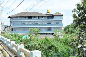 a blue building with a gold dome on top at Nirantara Luxury Service Apartment in Gonikoppal