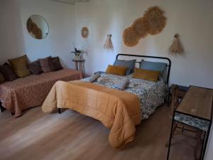 a bedroom with a bed and a couch at Mas denis in Arles +64 photos
