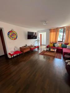 a living room with a couch and a table at Harmony Inn Miraflores in Lima