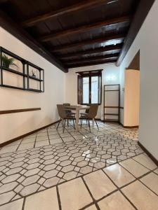 a dining room with a table and chairs at FRASCATI Suites in Frascati