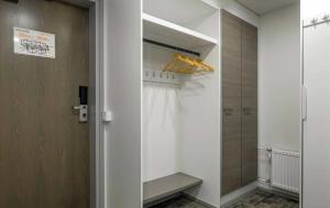 a bathroom with a closet with a shower backdoor at Ylläs Chalets IV 4309 in Ylläsjärvi