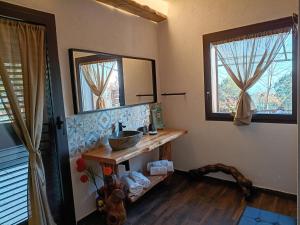 a bathroom with a sink and a mirror at Etna Country Home in Nicolosi +103 photos