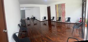 a conference room with chairs and a wooden floor at Harmony Inn Miraflores in Lima