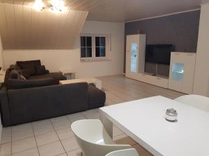 a living room with a couch and a tv at Ferienwohnung Stefanie OG in Bad Breisig