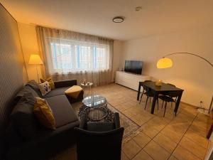 a living room with a couch and a table at Cozy Aparment 4 at Cathedral in Cologne