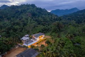 an aerial view of a house in the mountains at Evergreen Villa - Sinharaja in Deniyaya