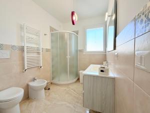 a bathroom with a shower and a toilet and a sink at Casa Zoe in Gallipoli