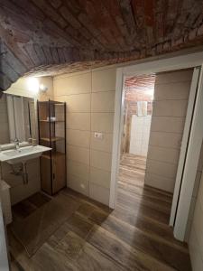 a bathroom with a sink and a mirror at B&B Blue Dragonfly in Paesana +29 photos