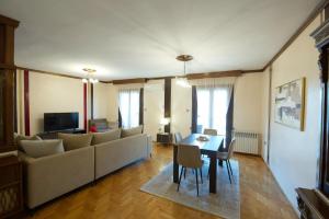 a living room with a couch and a table at Alexandra Welcome Maxi Place in Kastoria