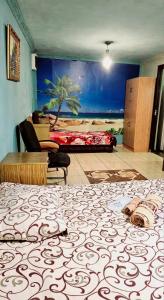 a bedroom with a bed with a painting on the wall at Asine Yerevan in Yerevan