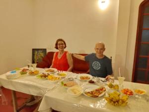 a man and a woman sitting at a table with food at Jayanika Residence in Tangalle +33 photos