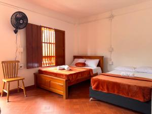 En eller flere senge i et værelse på Hotel Macao