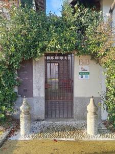 an entrance to a building with a gate at Tenuta Rio del Sole-Camera doppia in Albairate