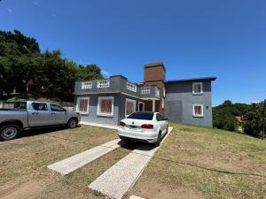 a white car parked in front of a house at Casa cairo in Ostende