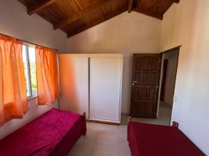 a bedroom with a bed and an open door at Casa cairo in Ostende