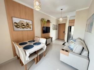a living room with a bed and a couch in it at Condomínio Reserva Almagre - MH in João Pessoa