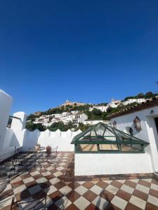 a view from the roof of a house with a tile floor at Hotel Casa Henrietta in Jimena de la Frontera