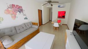 a living room with a couch and a table at Mimi’s dream Luján in Luján