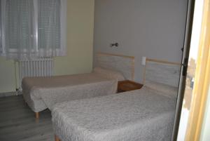 Postel nebo postele na pokoji v ubytování Le Logis Charmant