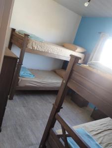 a couple of bunk beds in a room at Cabaña gio in Potrero de Garay