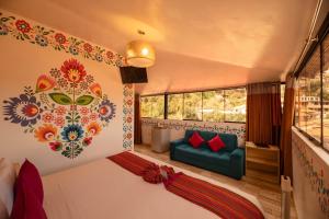 a bedroom with a bed and a couch in a room at Mayu Boutique Hotel in Cusco +133 photos