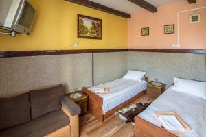Postel nebo postele na pokoji v ubytování Karczma Pod Topolami