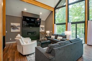 a living room with two couches and a tv at Sunset On The Greens by Railey Vacations in McHenry