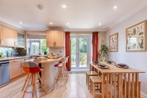 a kitchen with a large island and a table at 2 Bed in Shoreham-by-Sea oc-b29920 in Shoreham-by-Sea