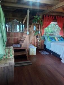 a bedroom with a bed in a wooden cabin at Cabaña Agustina in El Soberbio