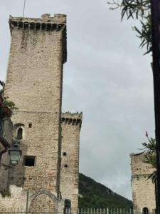 an old castle with two towers at Sotto le 3 Torri in Pacentro +13 photos