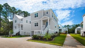 a large white house with a driveway at Harmony by the Bay in Santa Rosa Beach