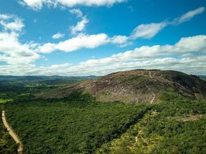 an aerial view of a mountain with a road at Mountain View Guesthouse: Peaceful Retreat near Tiradentes in Prados