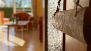a close up of a door with a living room at Backhuus 2 in Fehmarn