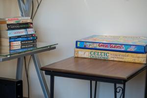 a stack of books sitting on a table at Trailhead Lodges 821 in Winter Park