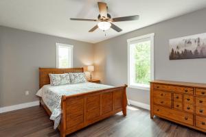 a bedroom with a bed and a ceiling fan at Blue Skies by Railey Vacations in Oakland
