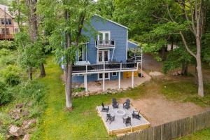 an aerial view of a blue house with a table and chairs at Blue Skies by Railey Vacations in Oakland
