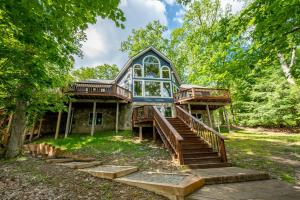 a house with stairs leading up to it at Blue Stone Lodge by Railey Vacations in Swanton