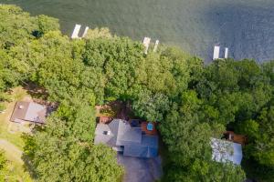 an overhead view of a house in the trees at Blue Stone Lodge by Railey Vacations in Swanton
