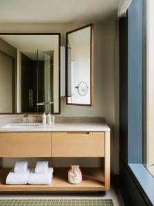 a bathroom with a sink and a mirror at The Atlas Hotel in Boston +31 photos