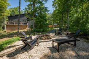 a group of benches and a fire pit in a yard at Bourbon Sunset by Railey Vacations in Swanton