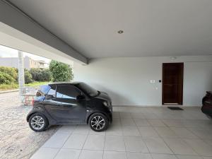 a small car parked inside of a building at LuxRoom in Patra