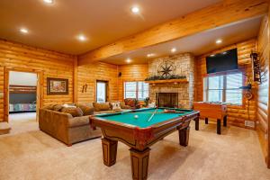 a living room with a pool table in it at Bracken Lodge by Railey Vacations in Swanton