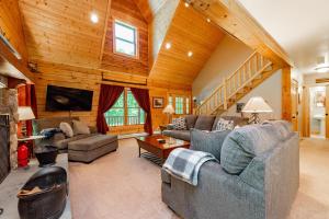 a living room with couches and a fireplace at Bucks Run by Railey Vacations in Oakland