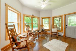 a living room with rocking chairs and windows at Bucks Run by Railey Vacations in Oakland +29 photos