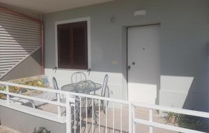 a balcony with a table and chairs on it at Terra di mare apartment & management in Zambrone