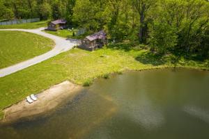 an aerial view of a house next to a lake at Modern Pond-View Cabin Near Lake of Egypt in Marion