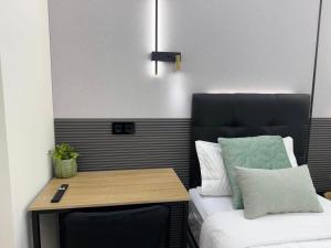 a room with a bed and a table and a bed sidx sidx sidx at Ap Fuenlabrada in Fuenlabrada