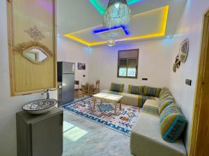 a living room with a couch and a table at Surf Apartment in Tamri Rooftop Local Experience in Tamri +22 photos