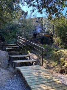 a group of wooden stairs leading up to a building at Nidos de Apalta in Santa Cruz +54 photos