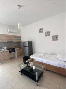 a kitchen with a bed and a table in a room at Nova Marine in Souda +26 photos